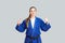 Positive athletic karate woman in blue kimono with black belt st