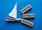 Positive attracts Positive symbol. Wooden blocks with words Positive attracts Positive. Beautiful blue background with boat.