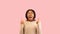 Positive Black Woman Pointing Fingers Upward Over Pink Background, Panorama