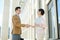 Positive business partners greeting each other