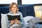 Positive calm woman holding open bible and thoughtfully reading