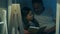Positive caring father reading a book with his cute daughter
