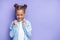 Positive and cheerful mulatto child girl isolated over purple background