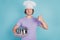 Positive chef cooker avertise cuisine hold pot raise thumb up approve choice