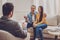 Positive delighted couple visiting therapist