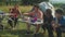 Positive diverse multiracial hikers preparing camp meal at campsite in mountains on trek