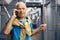 Positive elderly passenger talking on mobile phone in subway car