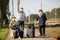 Positive elderly seniors people with face masks waiting train before traveling duringa pandemic