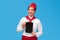 Positive ethnic air hostess showing tablet