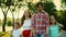 Positive family walking on street. Cheerful kids and parents laughing outdoors