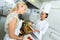 Positive female chefs posing with plate salad and cheese