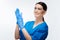 Positive female lab assistant washing hands