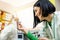 Positive female veterinarian checking cat