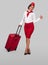 Positive flight attendant with checked baggage gesturing thumb up