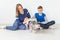 Positive good-looking mother and son launch their beautiful gray Scottish Fold cat into their new apartment after the