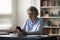 Positive grey haired business woman using smart online app
