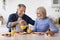 positive healthy pensioners enjoying delicious breakfast together