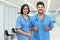 Positive latin american male and female nurses at vaccination station