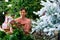 Positive latin american woman chooses a Christmas wreath