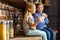 Positive little siblings drinking tea in the kitchen