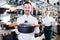 Positive loving couple deciding on best saucepan