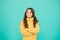 Positive mood. Kids psychology. Adorable smiling girl wear yellow sweater turquoise background. Positivity concept. Good