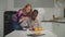 Positive multiethnic couple bonding in kitchen