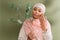 positive multiracial woman in pink hijab