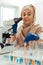 Positive muslim woman studying test samples in the lab