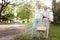 Positive pensioners looking for the place for picnic outdoors