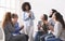 Positive people clapping at support group meeting, welcoming new member