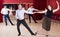 Positive people dancing lindy hop in pairs