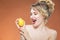 Positive Playful Caucasian Naked Girl Posing With Yellow Lemon