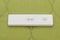 Positive pregnancy test on the green background