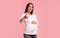 Positive Pregnant Lady Gesturing Thumbs Up Standing Over Pink Background