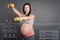 Positive pregnant woman enjoying sport exercises