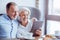 Positive senior loving couple resting in the cafe