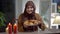 Positive slim young woman in hijab posing with homemade sweet delicious buns on plate. Medium shot portrait of charming