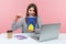 Positive smiling woman office worker holding model of paper house and europe union flag, dreaming about living in European country