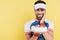 Positive sportsman in visor holding blurred