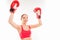 Positive sporty girl in boxing gloves raised her hands up and triumphing