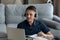 Positive student guy, intern in wireless headphones taking business course