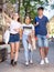 Positive teens walk along spring street