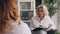 Positive therapist giving advice to obese lady during consultation in office