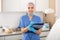 Positive woman cosmetician standing in office with clipboard