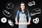 Positive woman holding a rolling pin while learning to cook bread