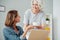 Positive woman sitting at the table