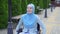 Positive young disabled woman in wheelchair Muslim hijab smiling outdoor