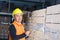 Positive young storekeeper at work in warehouse