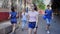 Positive young teen girl walks down the street